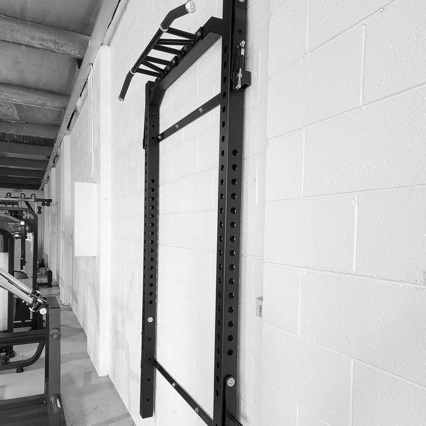 Wall-Mouted-Fold-Up-Rack-with-Attachments-4